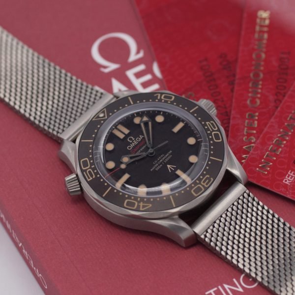 2263D. OMEGA SMP NTTD 007 TI Papers 11-2022 LC 100 (1)